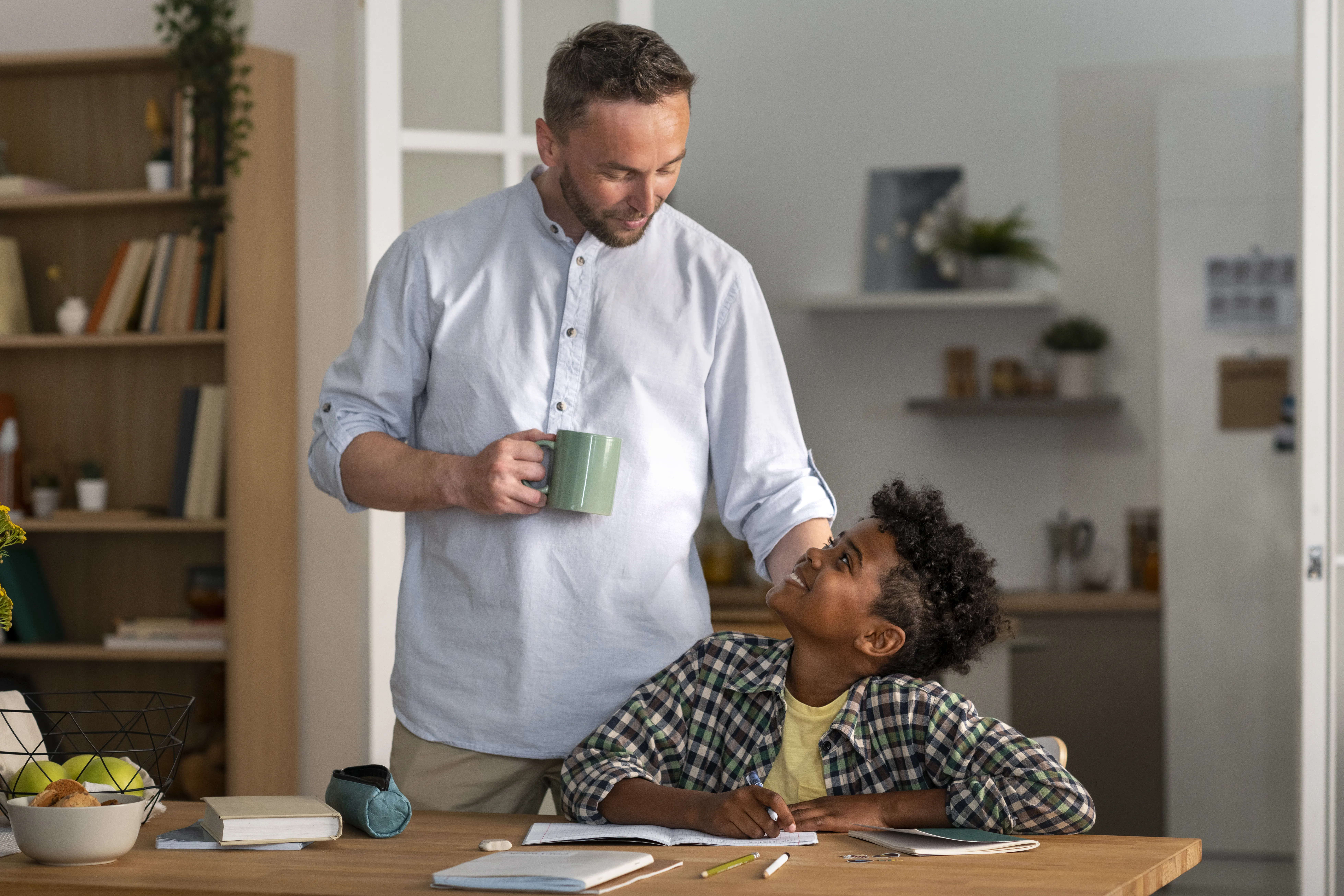 Adult and child sharing a warm moment at home