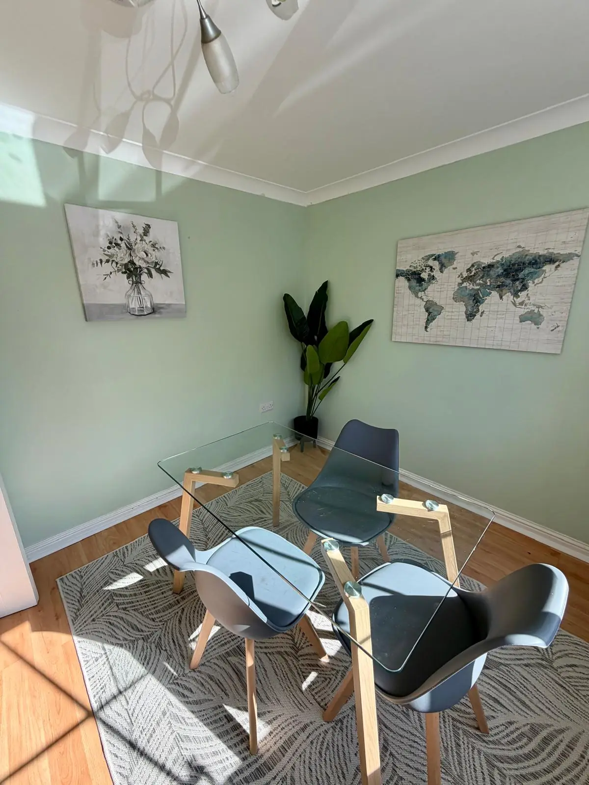 Quiet sitting space with glass table and chairs