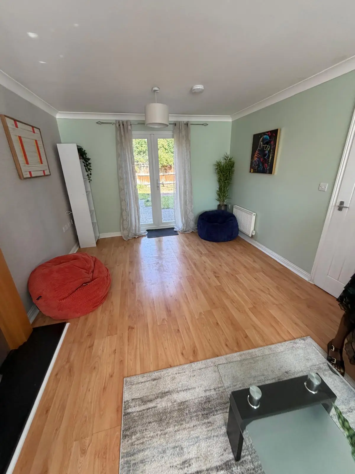 Reception room with beanbags and garden doors