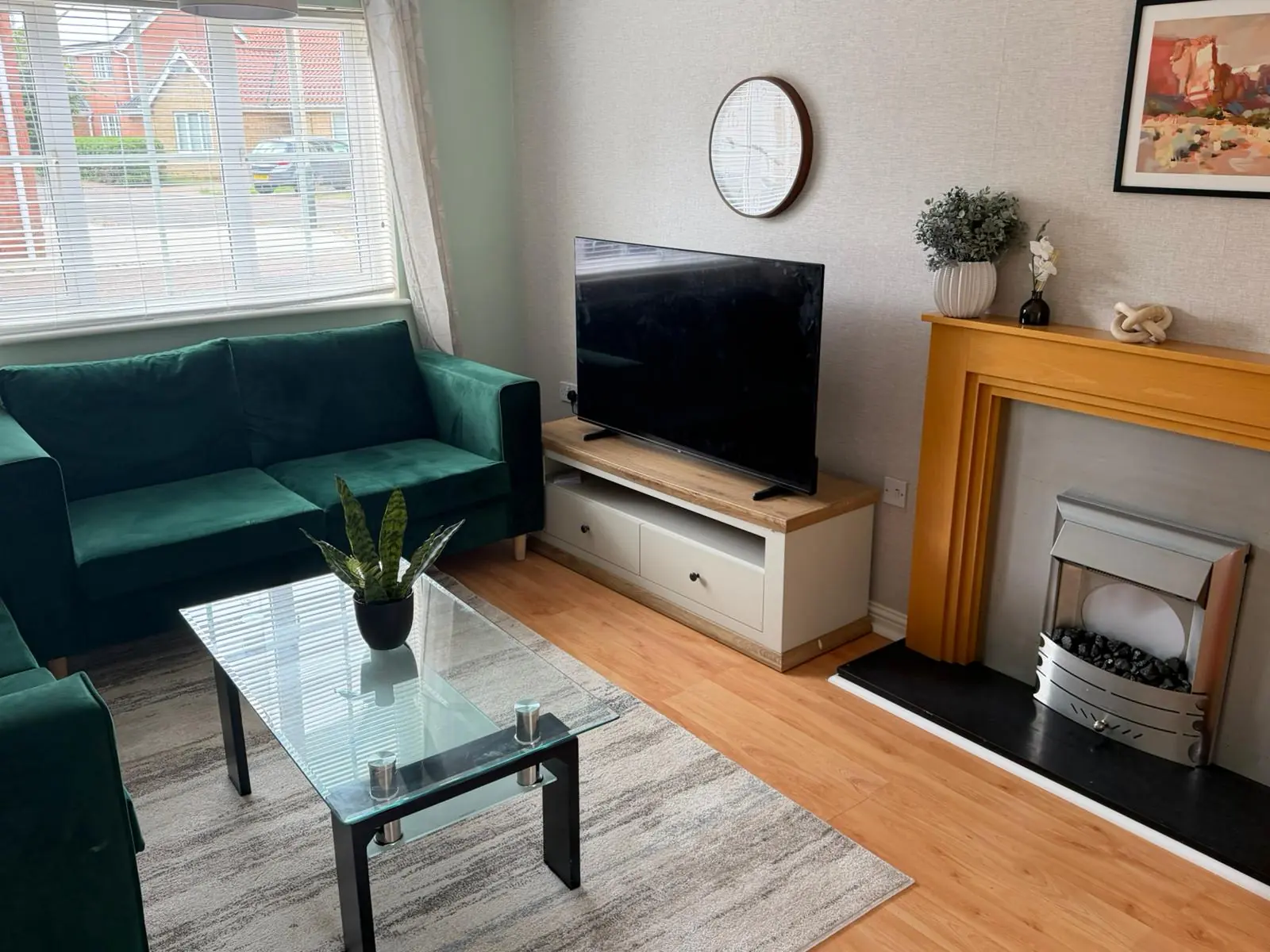 Lounge seating, television and fireplace