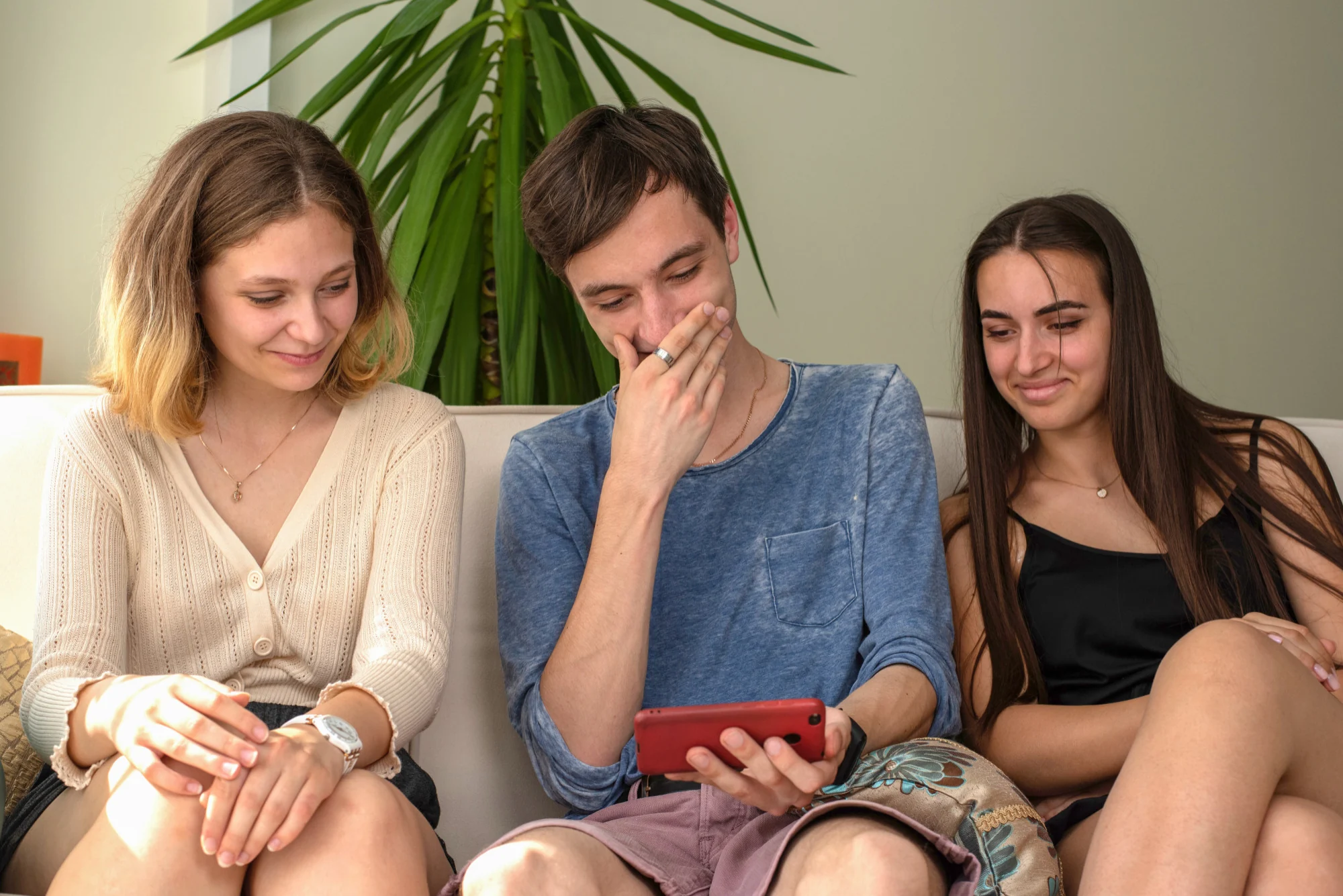 Young people relaxing together on a sofa in a calm home setting